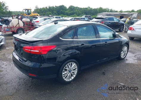 2016 Ford Focus Titanium z USA, uszkodzony, nr VIN 1FADP3J27GL215436